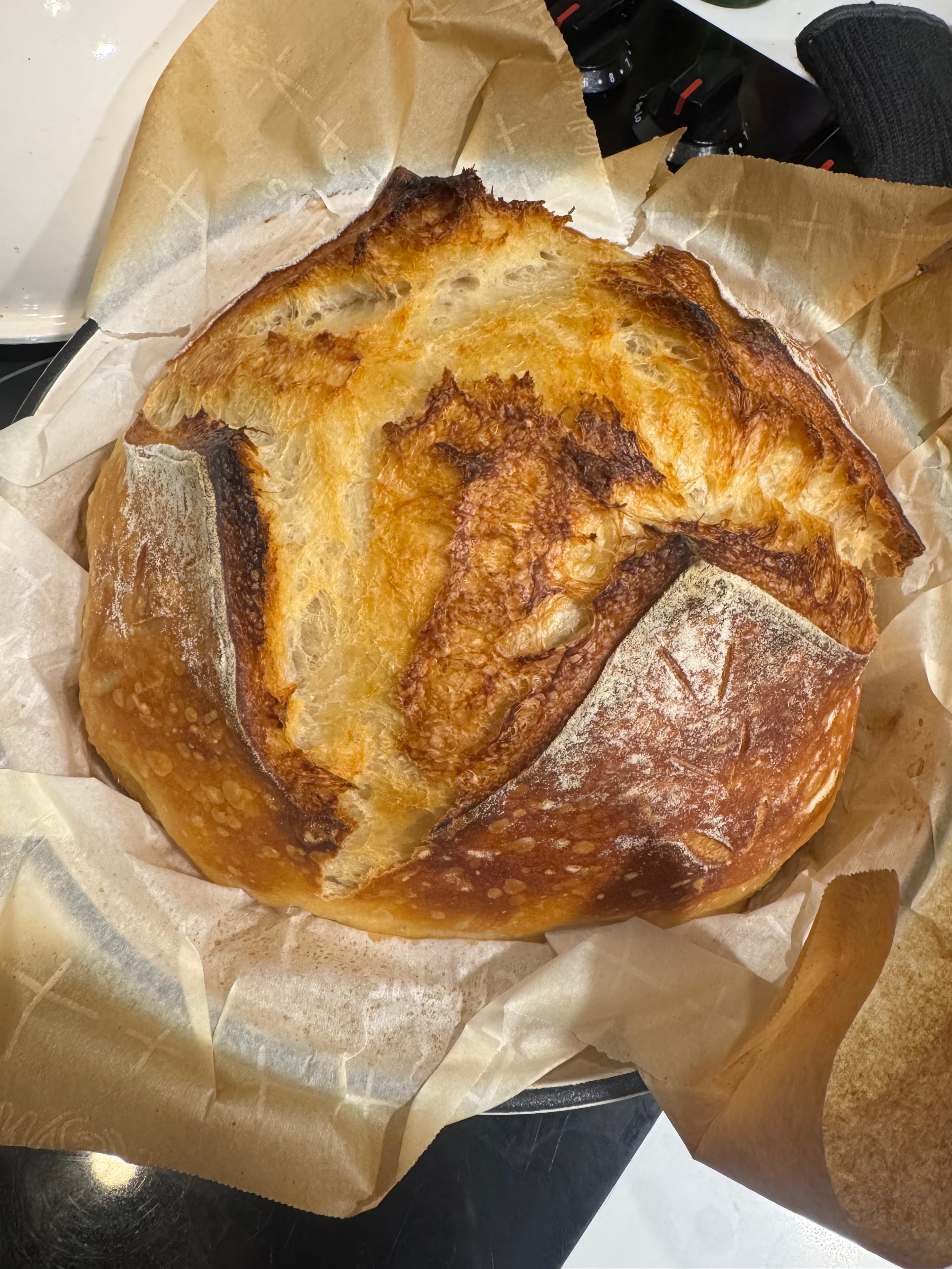 Classic sourdough loaf on parchment paper